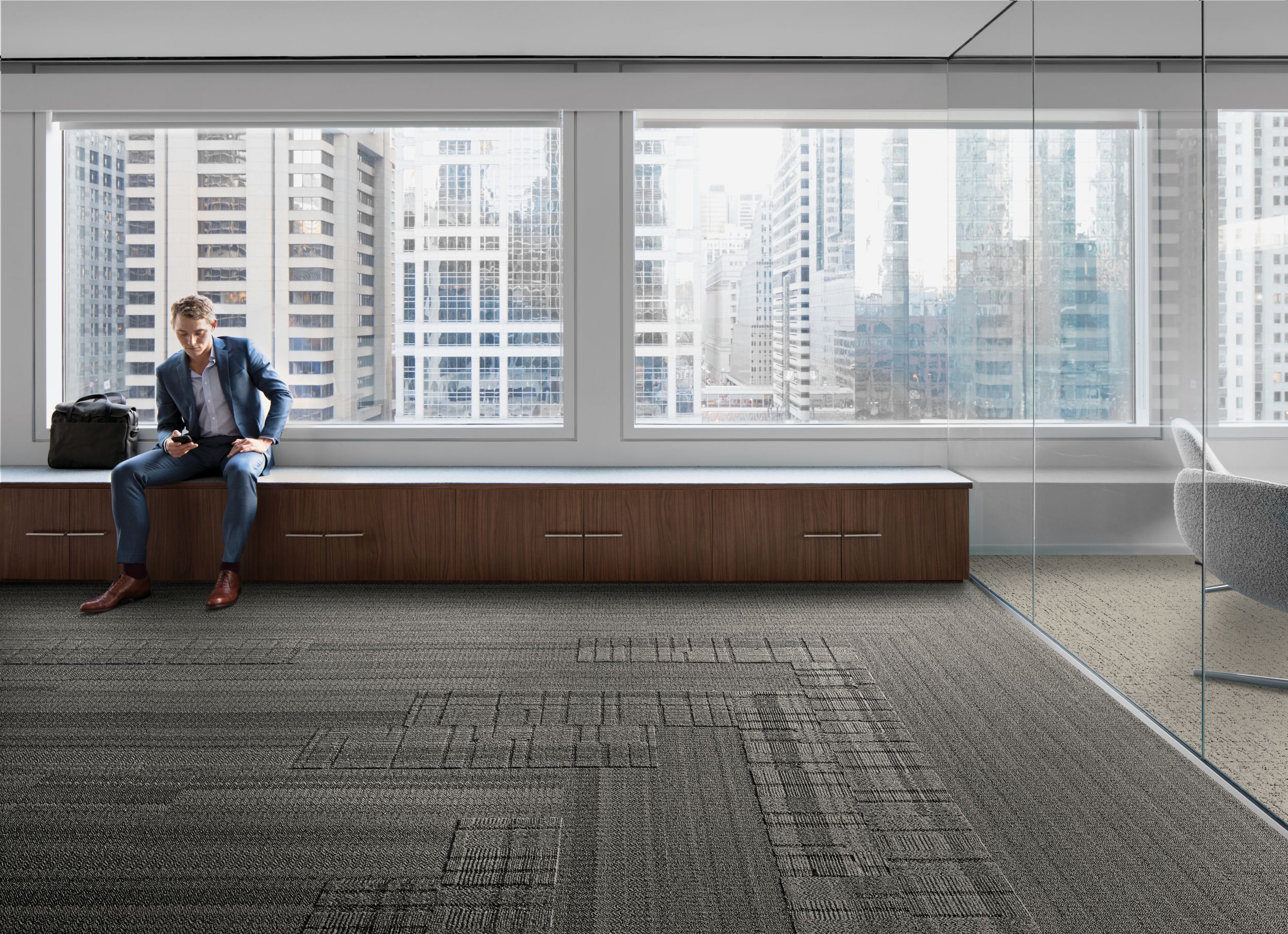 Interface Stitchery, Plain Stitch, and Stitch Count plank carpet tile in lobby area with man sitting on bench image number 4